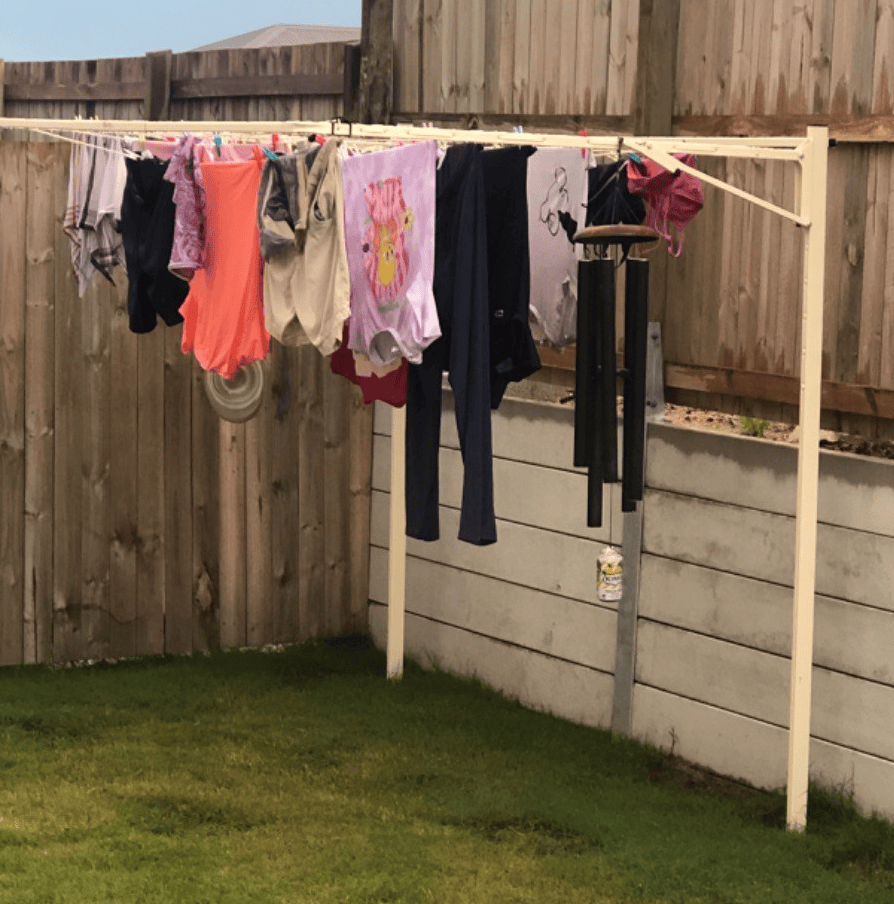 austral standard 28 clothesline ground mounted installed in lawn with washing on the line