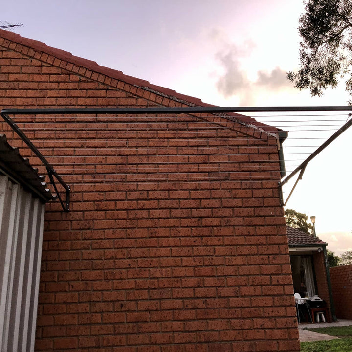 Austral Standard 28 clothesline in Woodland Grey mounted to brick wall