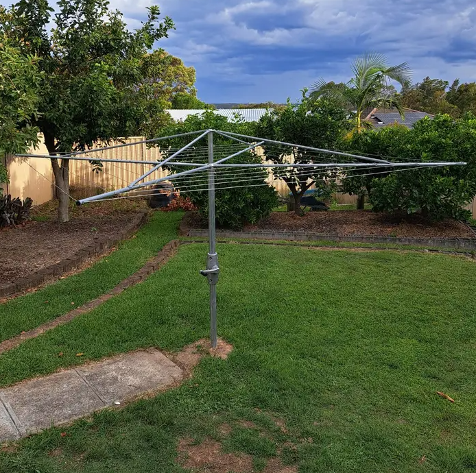 austral super 4 clothes line installed in lawn area