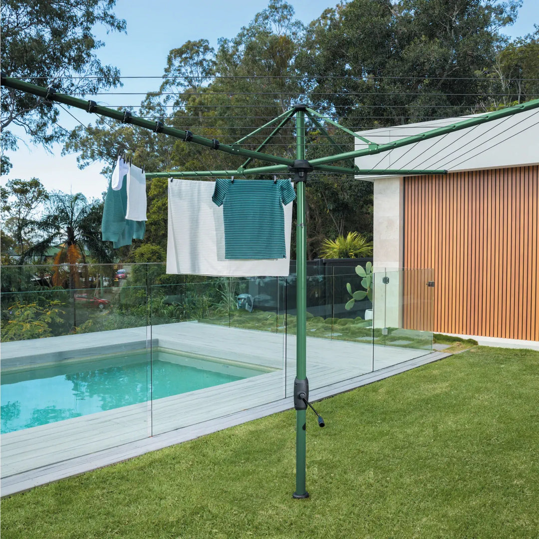 Hills hoist 7 line rotary clothesline installed in backyard in cottage green colour