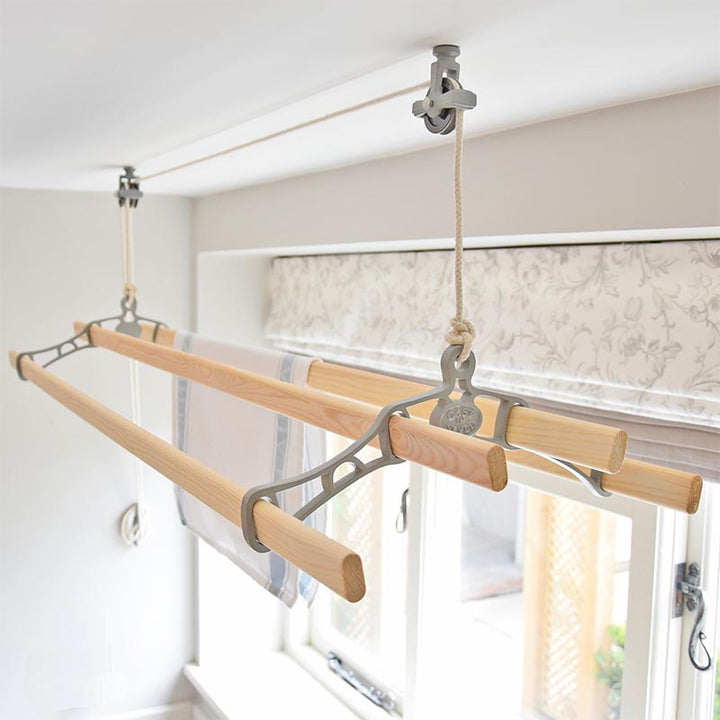 4 lath traditional ceiling clothes airer installed on a ceiling in a cream colour