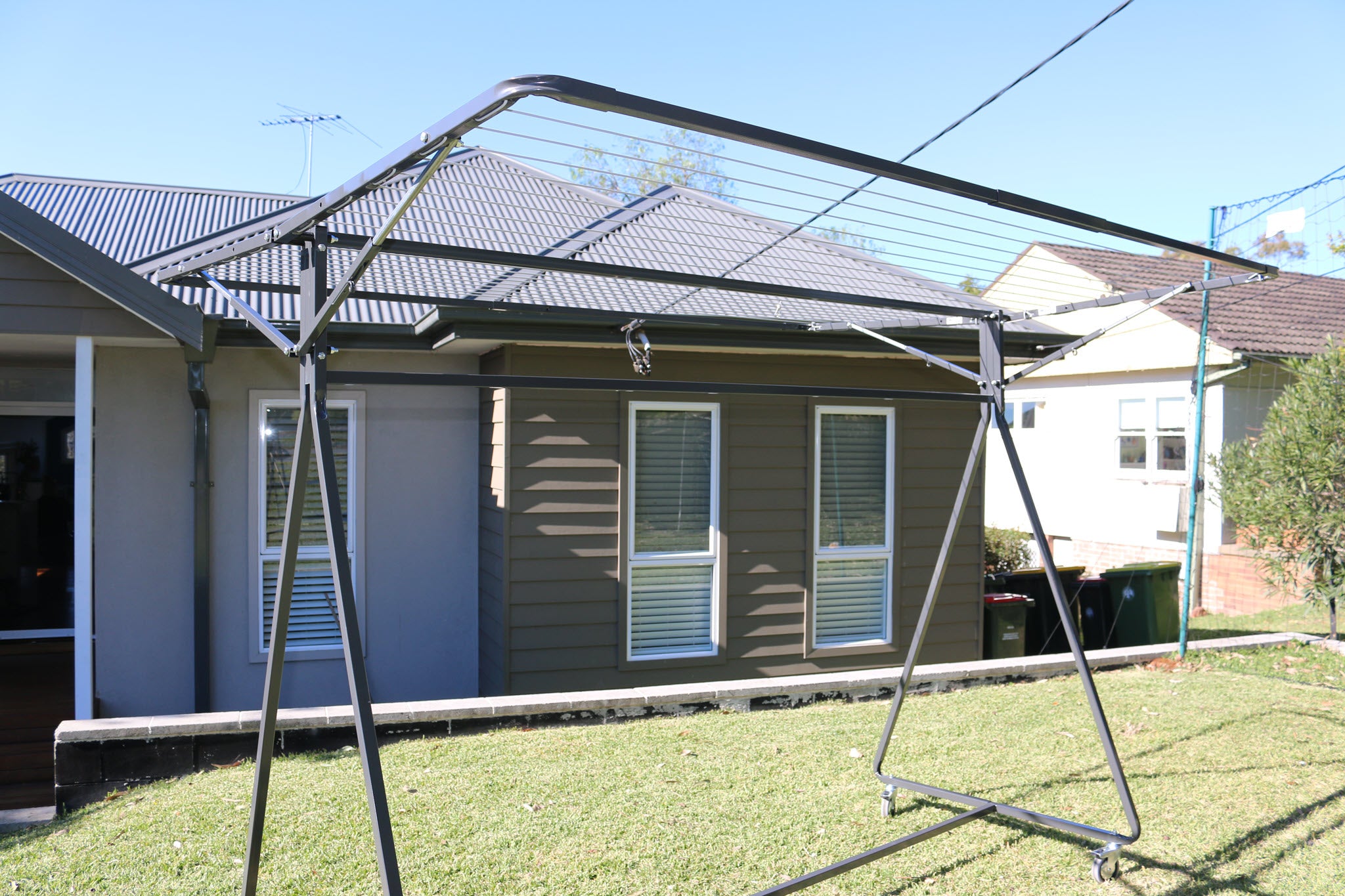 sunchaser mobile clothesline setup on front lawn of home
