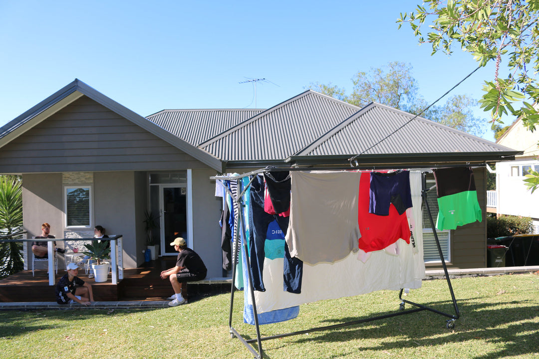 sunchaser clothesline on lawn area in front of house