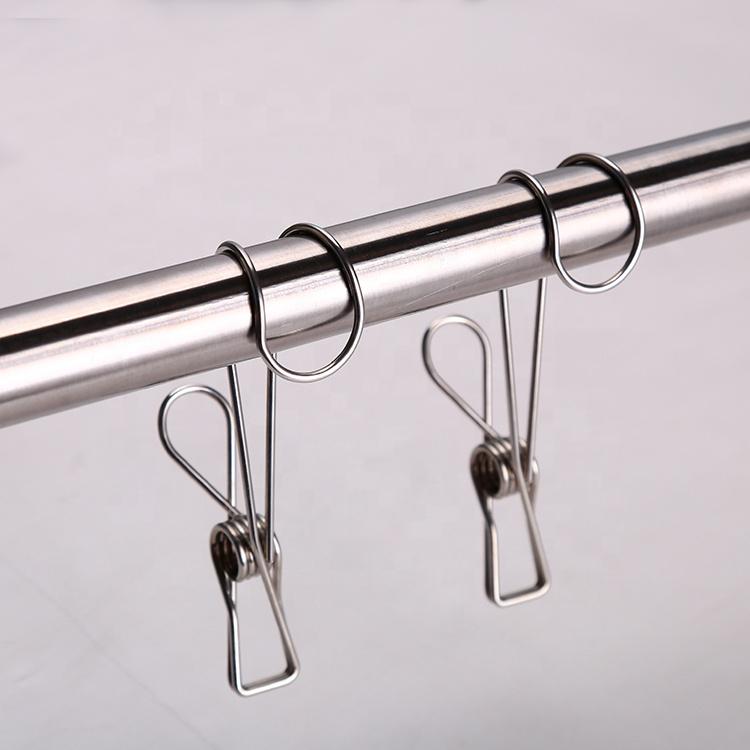 TopLine Stainless Steel Hooked Pegs pictured over rail ready for use.